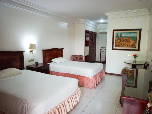 Postel nebo postele na pokoji v ubytování Hotel ASTURIAS BOUTIQUE