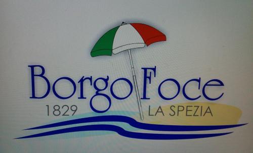 a sign for a barcodeduce with an umbrella at Borgo Foce La Spezia in La Foce