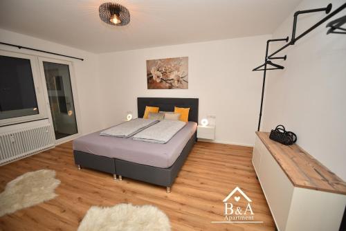 Ένα ή περισσότερα κρεβάτια σε δωμάτιο στο B & A Apartment mit Balkon