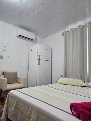 En eller flere senge i et værelse på Descanso para viajantes