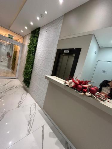 a bathroom with a counter with fruits and vegetables on it at Apartamento ACONCHEGANTE para família em Piratuba - Brisa Do Sol - Apto 401 in Piratuba