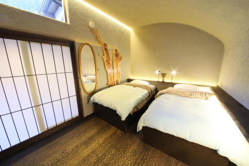 Llit o llits en una habitació de 水と翠