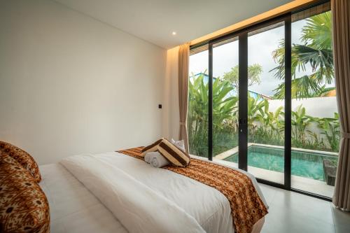 En eller flere senge i et værelse på Snuggy Shack Villas