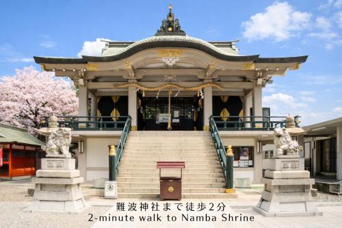 ein Tempel in Korea mit Treppe davor in der Unterkunft Takuto Hotel Osaka Shinsaibashi in Osaka