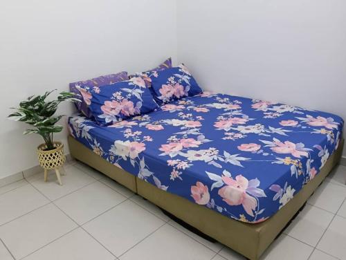 En eller flere senge i et værelse på Homestay Gapam Kasih