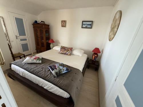 a bedroom with a bed with two pillows on it at Brise Marine Sxm in Marigot