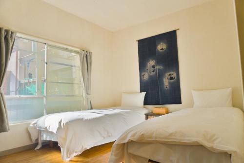 En eller flere senge i et værelse på Ikebukuro