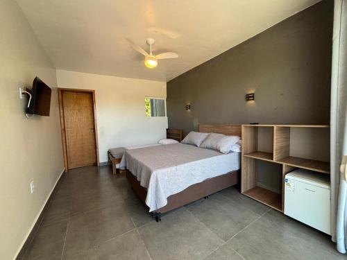 Een bed of bedden in een kamer bij Pousada Garden