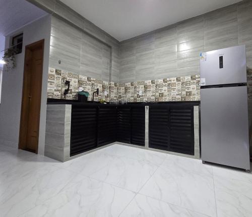 Een keuken of kitchenette bij Sua Estadia Angra