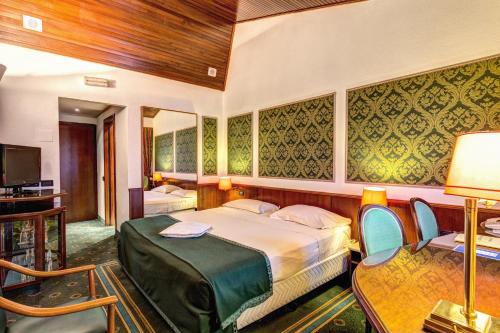 Postel nebo postele na pokoji v ubytování Hotel Motel Regal