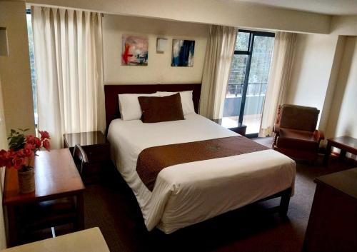 Postel nebo postele na pokoji v ubytování Hotel Ferrua