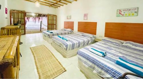 En eller flere senge i et værelse på Casa de playa San Marino Camana