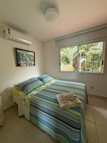 En eller flere senge i et værelse på Angra pé na areia