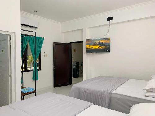 Postel nebo postele na pokoji v ubytování Hotel Sala 4 Malioboro