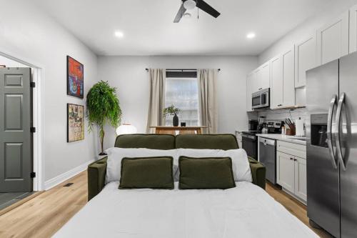 a kitchen with a large bed in a room at Studio Apt. Near Alamo Drafthouse, SLU & Downtown in Saint Louis
