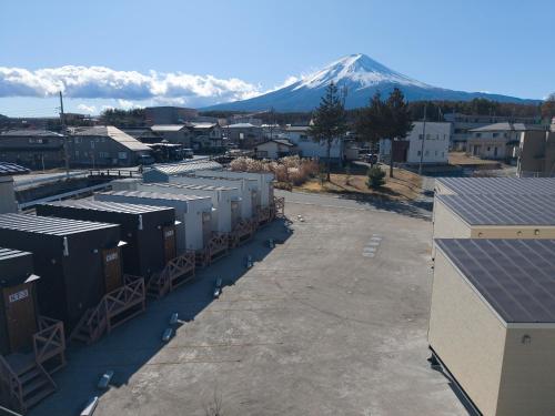 arial view of a city with a mountain in the background at Solana Smart INN富士河口湖 in Minamitsuru