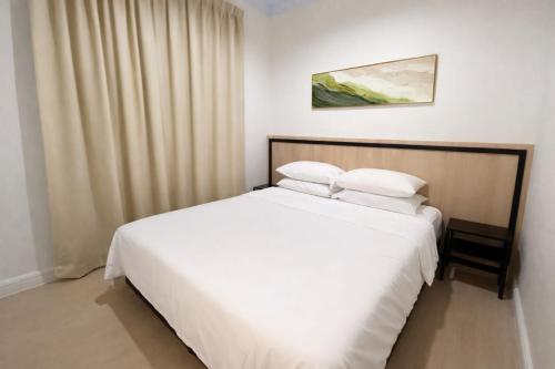 En eller flere senge i et værelse på Kanza Beach Inn