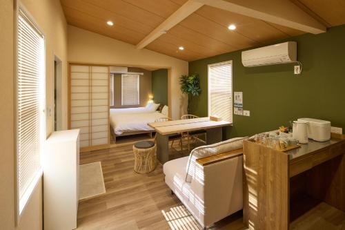 a room with a bathroom with a bed and a sink at Solana Smart INN富士河口湖 in Minamitsuru