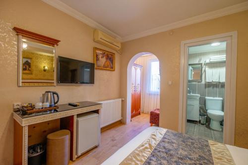 Kuchyň nebo kuchyňský kout v ubytování Big Apple Hotel and Hostel