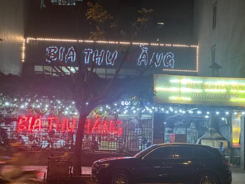 a car parked in front of a building with lights at Hoa Hồng 301MD in Hanoi