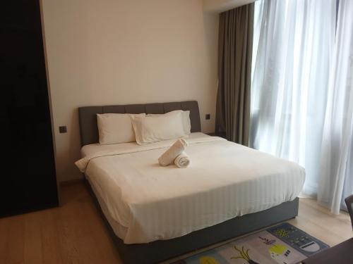 En eller flere senge i et værelse på Star residence klcc by S&S