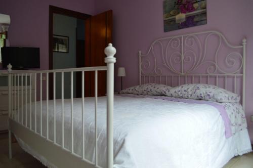 A bed or beds in a room at La Sorgente B&B