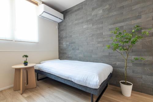 Ένα ή περισσότερα κρεβάτια σε δωμάτιο στο ベルビー京島 Belle Vie Kyoujima