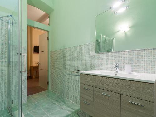 a bathroom with a sink and a shower at Il Borgo House in Cagliari