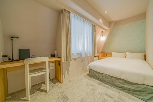 Ένα ή περισσότερα κρεβάτια σε δωμάτιο στο Center Hotel Tokyo