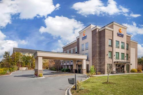 a rendering of a hotel with a parking lot at Comfort Inn & Suites Florence Center Area in Florence
