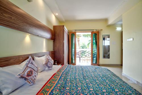 Postel nebo postele na pokoji v ubytování Eufregina Resort & Spa - South Goa