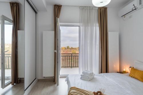 En eller flere senge i et værelse på City Gardens Villa