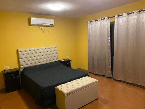 En eller flere senge i et værelse på Casa de verano - alquiler temporario