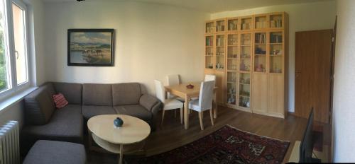 a living room with a couch and a table at Apartman Elena in Kežmarok