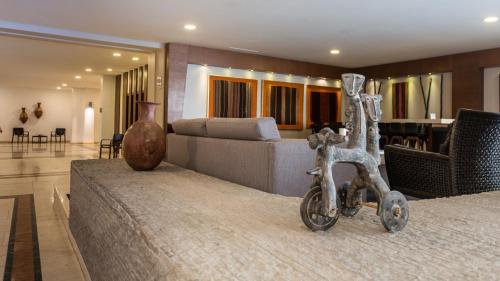 a living room with a couch and a table at Hotel Antofagasta in Antofagasta