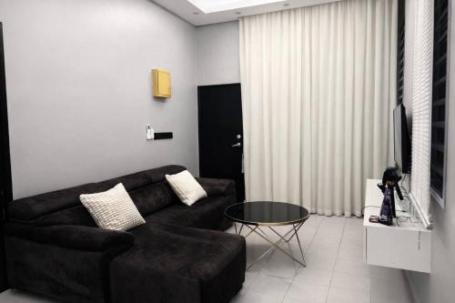 Khu vực ghế ngồi tại Adam Luxe Homestay Tapah