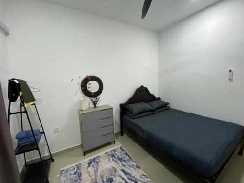 Postel nebo postele na pokoji v ubytování Marina Homestay