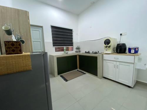 Kuchyň nebo kuchyňský kout v ubytování Marina Homestay