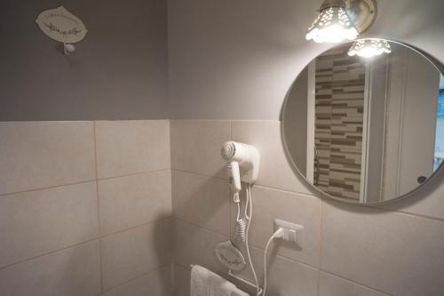 a bathroom with a shower and a mirror at B&B Donna Ada in Salerno