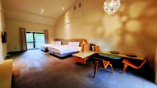 Postel nebo postele na pokoji v ubytování 新光兆豐花蓮旅館