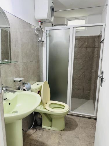 a bathroom with a toilet and a sink and a shower at 35-B-5 Kandy in Kandy