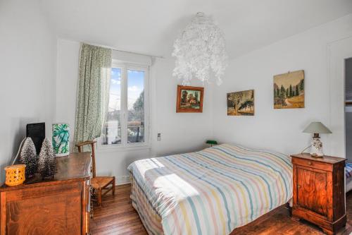 En eller flere senge i et værelse på Chez Poton