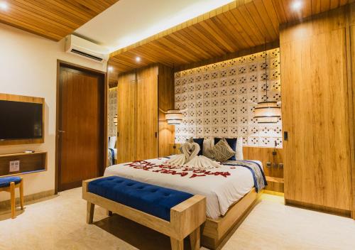 En eller flere senge i et værelse på The Mavila Sanur