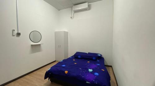 a room with a bed in a room with a mirror at Marang Private Pool Homestay - 3-Bedroom - Family & Group Stay in Marang