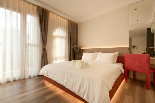 Postel nebo postele na pokoji v ubytování HAITA Suites