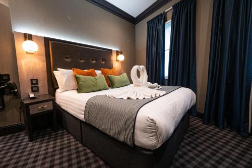 a hotel room with a large bed in a room at The House of Toby in London