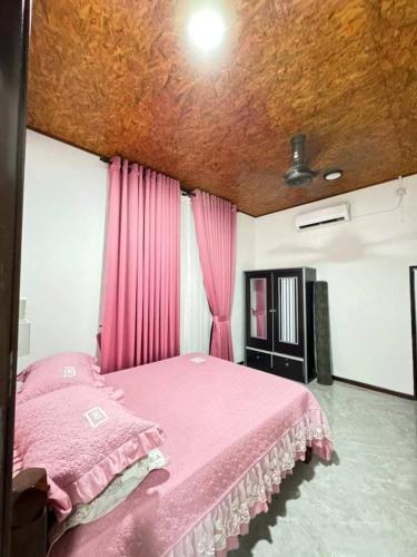 Postel nebo postele na pokoji v ubytování Damai Homestay