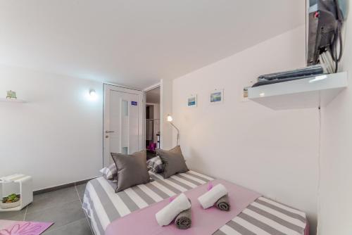 Postel nebo postele na pokoji v ubytování Apartment Luce Mala
