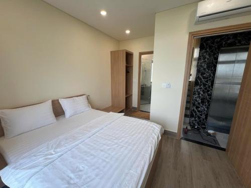 En eller flere senge i et værelse på T Homestay