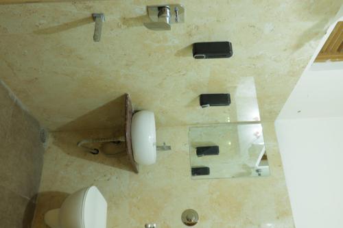 an overhead view of a bathroom with a toilet at The Lake Haveli in Udaipur